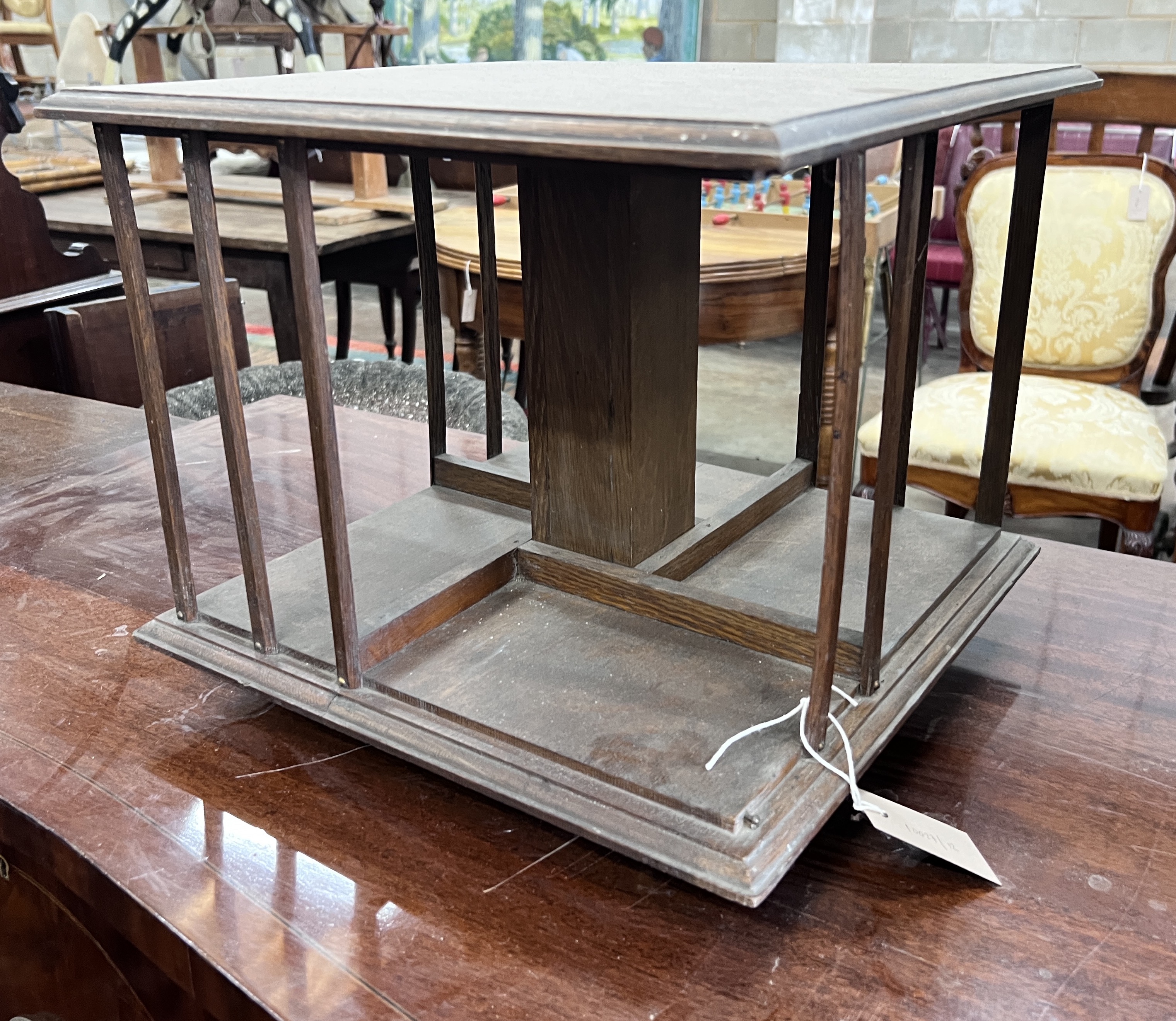 An Edwardian oak table top revolving bookcase, width 37cm, height 31cm